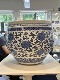 A massive Chinese blue and white 'lotus scroll' fish bowl, Qianlong/Jiaqing