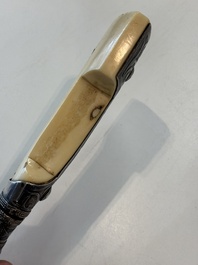 A Caucasian walrus bone-hilted kindjal with niello silver mounts, 19th C.