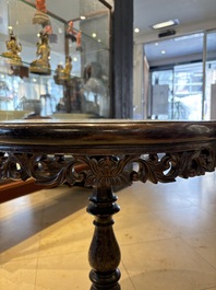 A Chinese mother-of-pearl-inlaid hongmu table with a circular Canton famille verte 'warriors on horseback' plaque, 19th C.