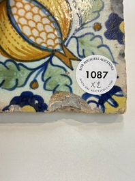 Two small polychrome Dutch Delft 'pomegranates' and 'tulips' tiles, ca. 1600