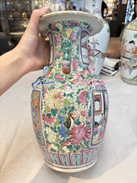 A pair of Chinese famille rose vases with narrative design on wooden stands, 19th C.