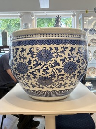 A massive Chinese blue and white 'lotus scroll' fish bowl, Qianlong/Jiaqing