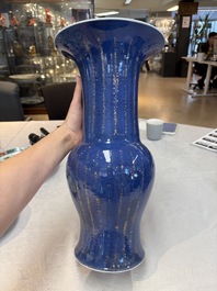 A pair of Chinese gilt-decorated powder-blue 'yenyen' vases, Kangxi