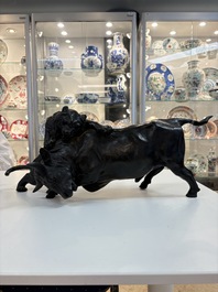 A Japanese bronze okimono of a tiger and a bull, signed Sano Takachika 佐野隆親, Meiji, 19th C.