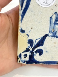 Two blue and white Dutch Delft 'castle' and 'soldier with coloured flame' tiles, 17th C.