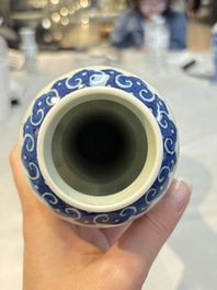 A Chinese blue, white and copper-red garlic-mouth vase with mythical animals, Kangxi mark, 19th C.