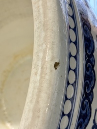 A massive Chinese blue and white 'lotus scroll' fish bowl, Qianlong/Jiaqing