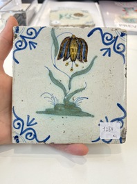 Two polychrome Dutch Delft 'flower' tiles, 17th C.