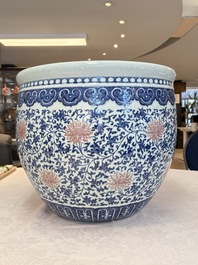 A fine Chinese blue, white and copper-red 'lotus scroll' fish bowl, Qianlong