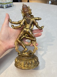 A Nepalese or Tibetan turquoise-inlaid gilt-bronze sculpture of Kurukulla or Red Tara, 15th C. or later