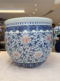A fine Chinese blue, white and copper-red 'lotus scroll' fish bowl, Qianlong