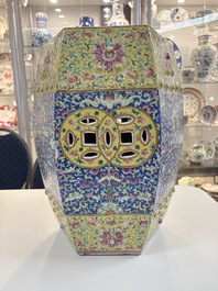 A Chinese famille rose blue and yellow-ground hexagonal garden seat, 19th C.