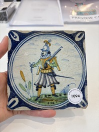 A polychrome Dutch Delft maiolica 'soldier' medallion tile, late 16th C.
