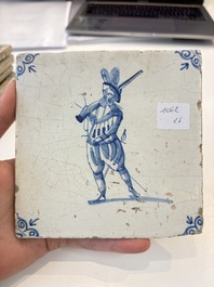 Six blue and white Dutch Delft 'figure' tiles , 17th C.
