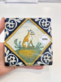 A small polychrome Dutch Delft maiolica 'dog' tile, late 16th C.