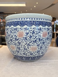 A fine Chinese blue, white and copper-red 'lotus scroll' fish bowl, Qianlong
