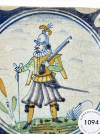 A polychrome Dutch Delft maiolica 'soldier' medallion tile, late 16th C.