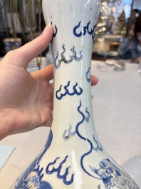 A Chinese blue, white and copper-red garlic-mouth vase with mythical animals, Kangxi mark, 19th C.