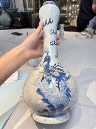 A Chinese blue, white and copper-red garlic-mouth vase with mythical animals, Kangxi mark, 19th C.