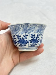 A set of four Chinese blue and white cups and saucers, flower mark, 19th C.