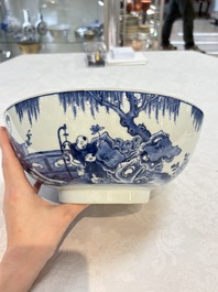 A Chinese blue and white punch bowl with a lady and two boys in a garden, Qianlong