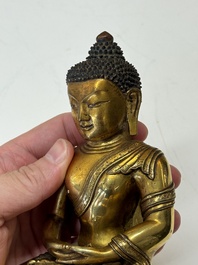 A fine Sino-Tibetan gilt-bronze figure of Buddha Shakyamuni, 17th C.