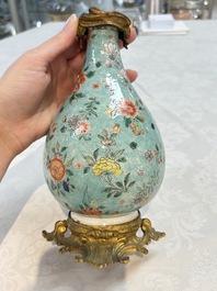 A Chinese wucai square covered container, a gilt bronze-mounted famille verte vase and a Canton famille verte bottle vase, Kangxi and later
