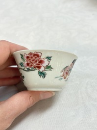 A Chinese famille rose 'roosters' covered teapot and two cups and saucers, Yongzheng