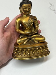A fine Sino-Tibetan gilt-bronze figure of Buddha Shakyamuni, 17th C.