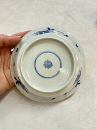 A set of four Chinese blue and white cups and saucers, flower mark, 19th C.