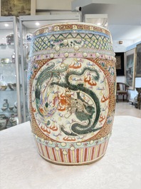 A pair of Chinese famille rose 'dragon and phoenix' garden seats, 19/20th C.