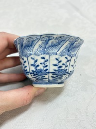 A set of four Chinese blue and white cups and saucers, flower mark, 19th C.