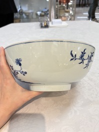 A Chinese blue and white punch bowl with a lady and two boys in a garden, Qianlong