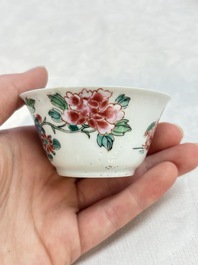 A Chinese famille rose 'roosters' covered teapot and two cups and saucers, Yongzheng