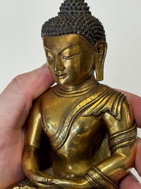 A fine Sino-Tibetan gilt-bronze figure of Buddha Shakyamuni, 17th C.