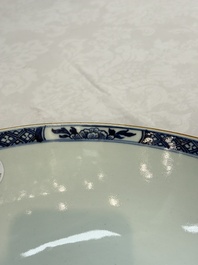 A Chinese blue and white punch bowl with a lady and two boys in a garden, Qianlong