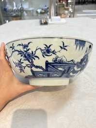A Chinese blue and white punch bowl with a lady and two boys in a garden, Qianlong