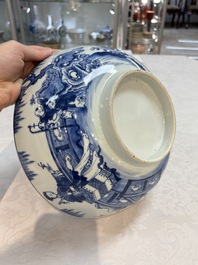 A Chinese blue and white punch bowl with a lady and two boys in a garden, Qianlong