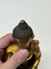 A fine Sino-Tibetan gilt-bronze figure of Buddha Shakyamuni, 17th C.