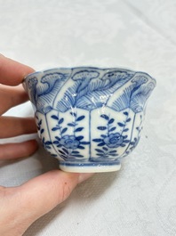 A set of four Chinese blue and white cups and saucers, flower mark, 19th C.