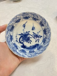 A set of four Chinese blue and white cups and saucers, flower mark, 19th C.
