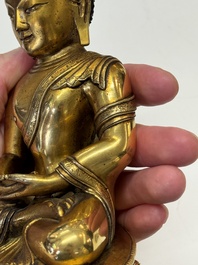 A fine Sino-Tibetan gilt-bronze figure of Buddha Shakyamuni, 17th C.