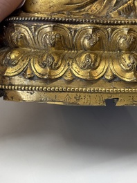 An extremely rare and fine Chinese gilt-bronze Buddha, inscribed 大明正統己未金川比丘昌靜捐資命工造, Zhengtong mark and of the period, dated 1439