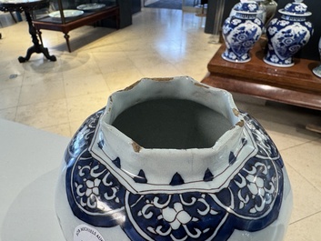 A blue, white and manganese Dutch Delft chinoiserie vase and cover, ca. 1700