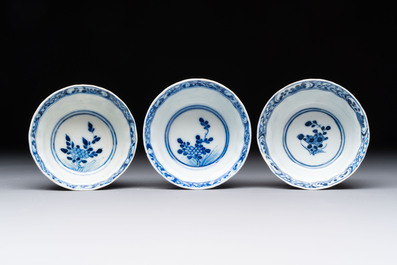 Ten Chinese blue and white cups and nine saucers, Kangxi mark, 19th C.