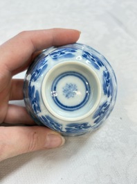 A set of four Chinese blue and white cups and saucers, flower mark, 19th C.