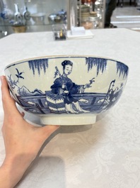 A Chinese blue and white punch bowl with a lady and two boys in a garden, Qianlong