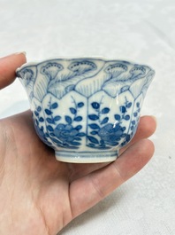 A set of four Chinese blue and white cups and saucers, flower mark, 19th C.