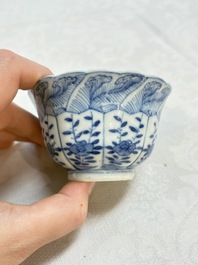 A set of four Chinese blue and white cups and saucers, flower mark, 19th C.