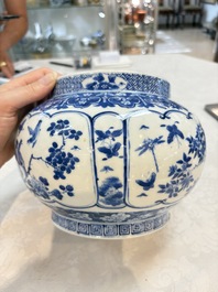 A Chinese blue and white 'birds among flowering branches' vase, Kangxi mark, 19th C.